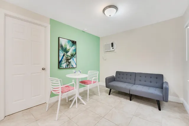 a bedroom with a bed and a chair