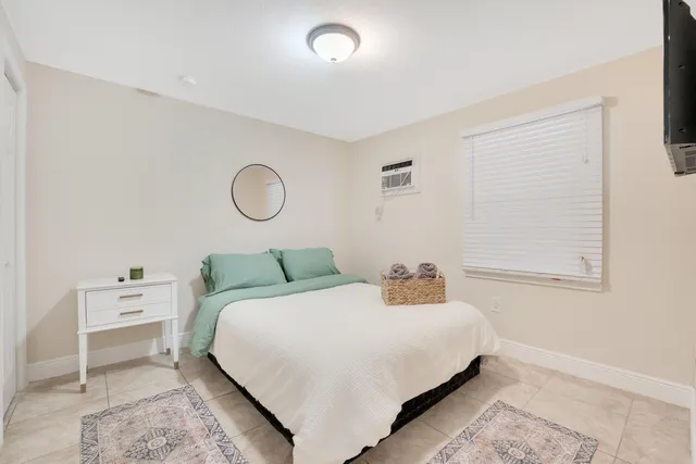 a bathroom with a sink a toilet and shower curtain