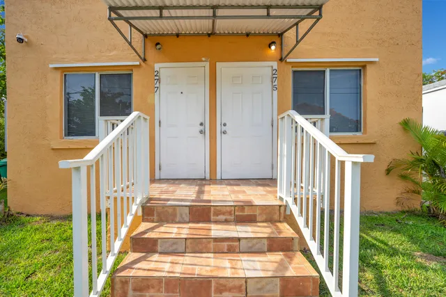 a view of balcony with wooden floor and stairs