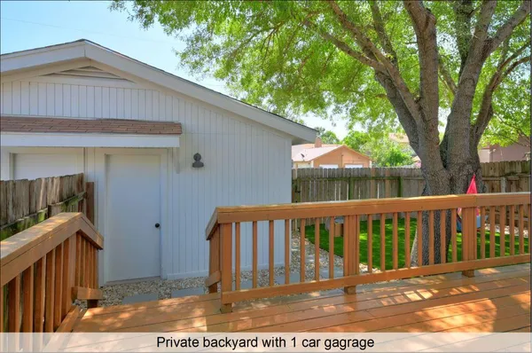 a view of wooden fence and a yard