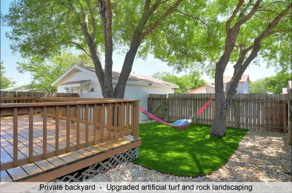 a view of a bench in a backyard