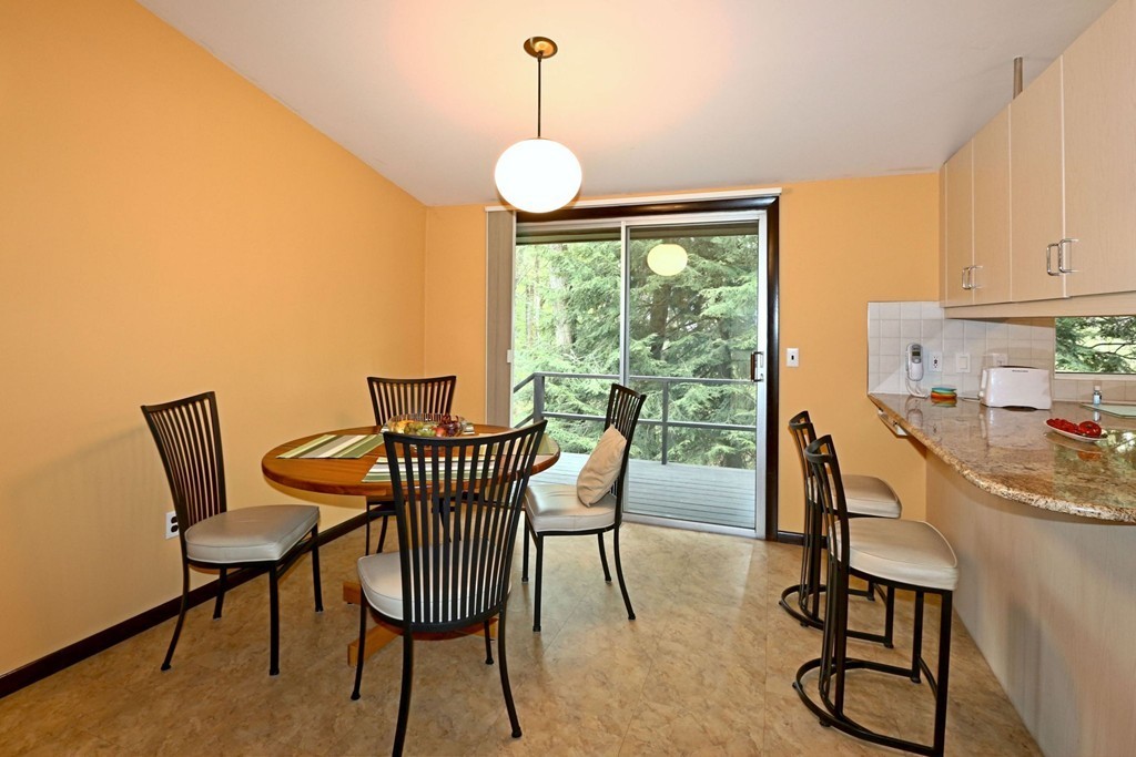 4 Holiday Road Wayland, MA 01778 - Photo 14 of 25 a view of a dining room with furniture window and outside view