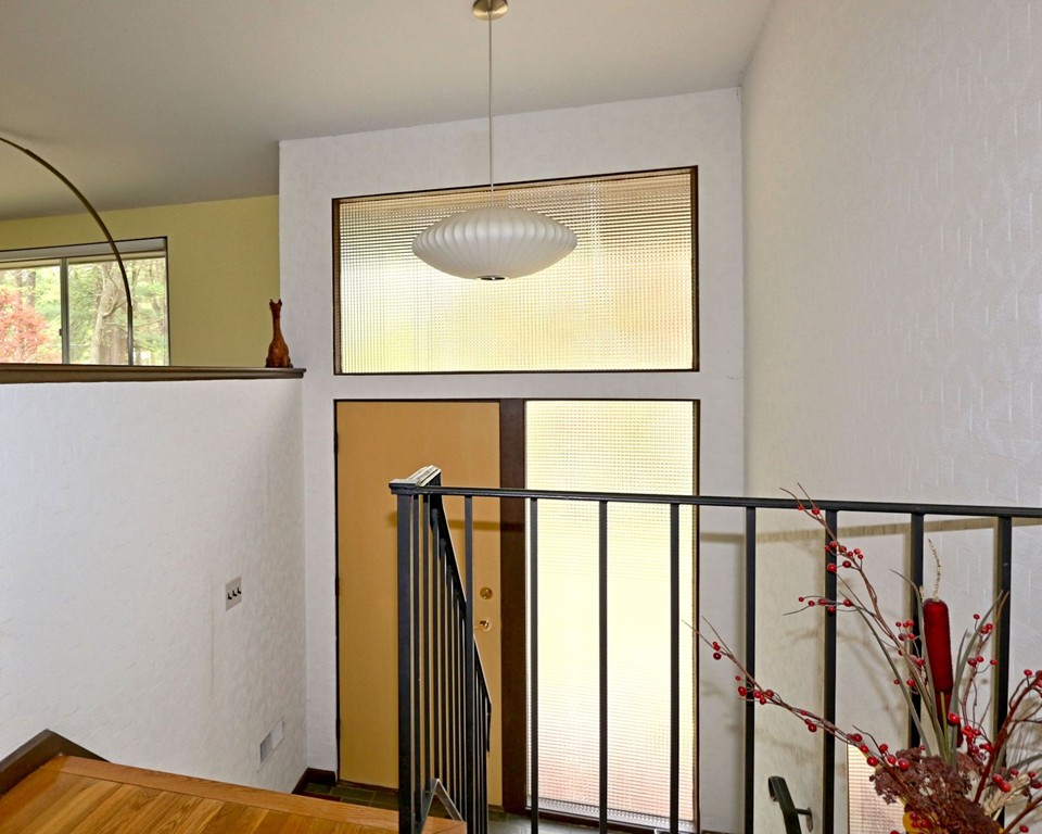 4 Holiday Road Wayland, MA 01778 - Photo 5 of 25 a view of walk in closet with window and wooden floor
