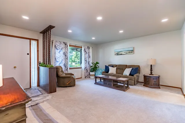 a living room with furniture and a window