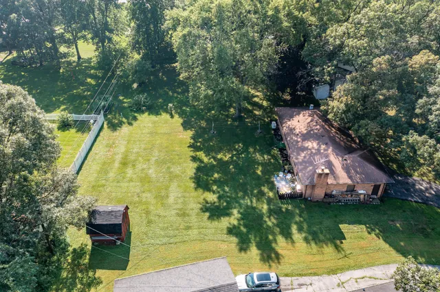 a view of a lake with a house in the background