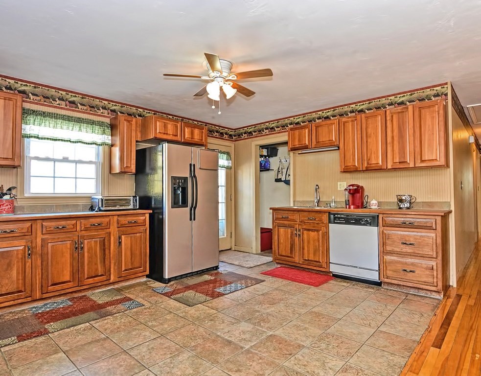 88 Rice Corner Road Brookfield, MA 01506 - Photo 13 of 39 a kitchen with stainless steel appliances granite countertop a refrigerator and a stove top oven