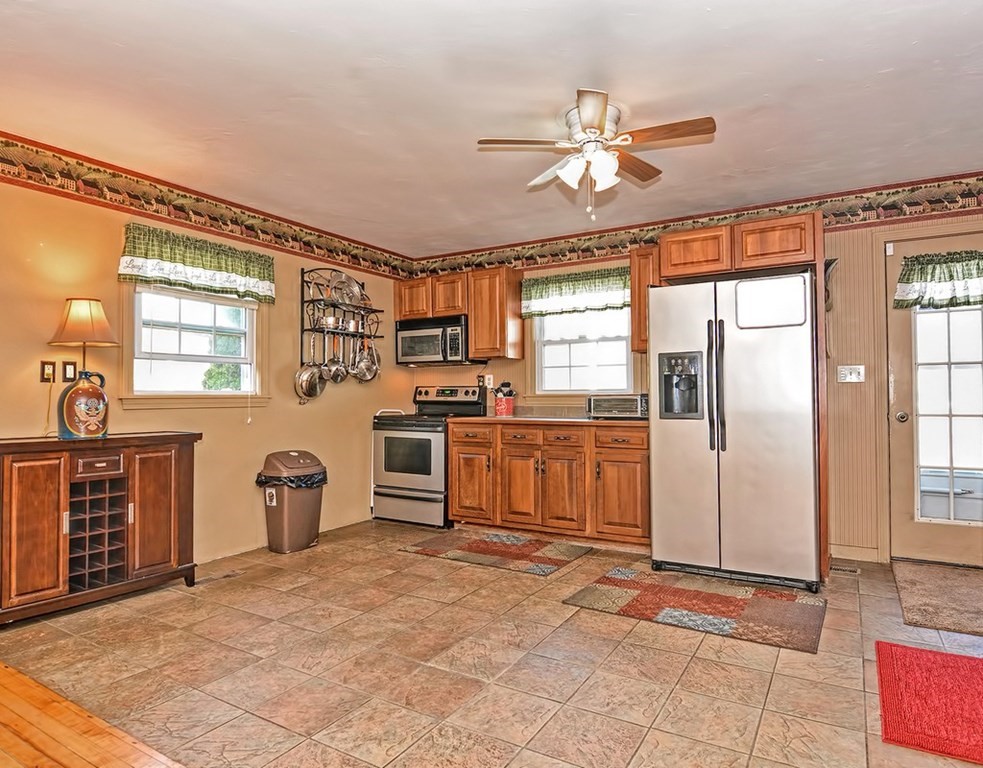 88 Rice Corner Road Brookfield, MA 01506 - Photo 15 of 39 a view of a kitchen with furniture and windows
