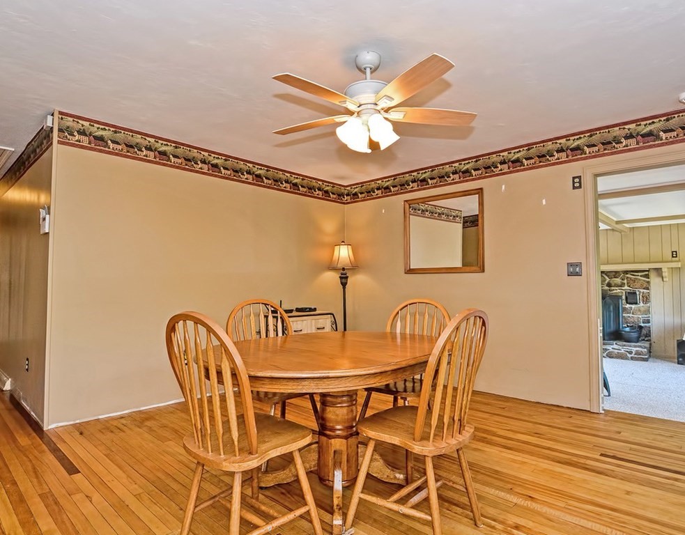 88 Rice Corner Road Brookfield, MA 01506 - Photo 16 of 39 a dining room with furniture and wooden floor