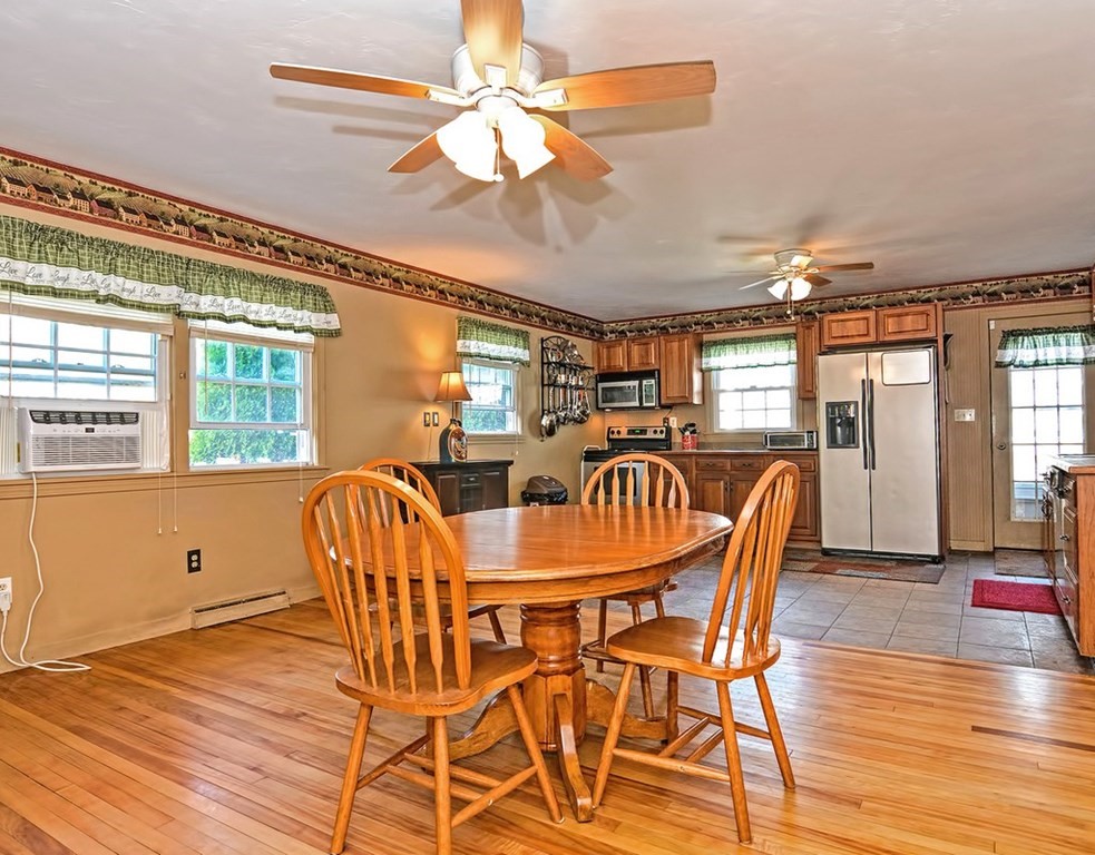 88 Rice Corner Road Brookfield, MA 01506 - Photo 18 of 39 a dining room with furniture a chandelier and wooden floor