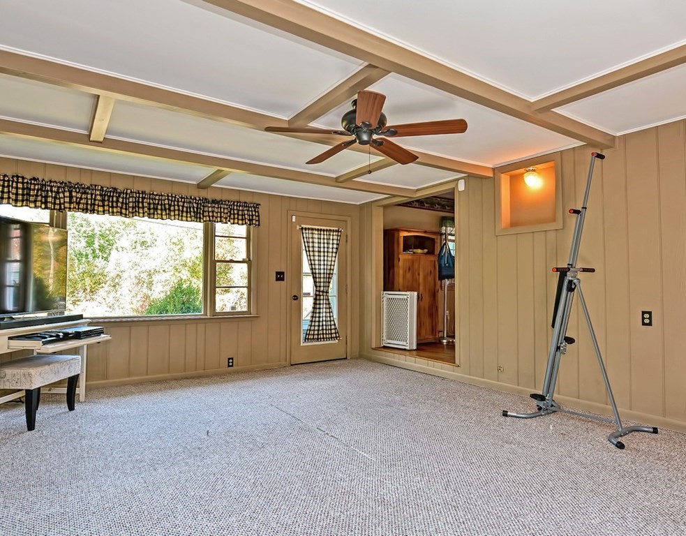 88 Rice Corner Road Brookfield, MA 01506 - Photo 19 of 39 a view of empty room with wooden floor and windows