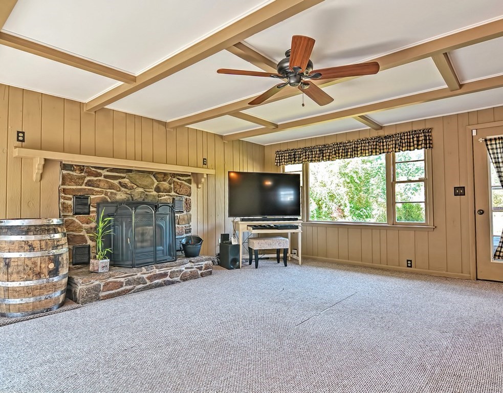 88 Rice Corner Road Brookfield, MA 01506 - Photo 20 of 39 a living room with furniture and a flat screen tv