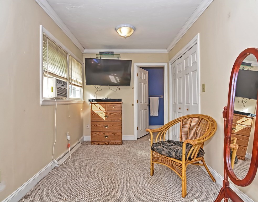 88 Rice Corner Road Brookfield, MA 01506 - Photo 30 of 39 a living room with furniture a flat screen tv and a window