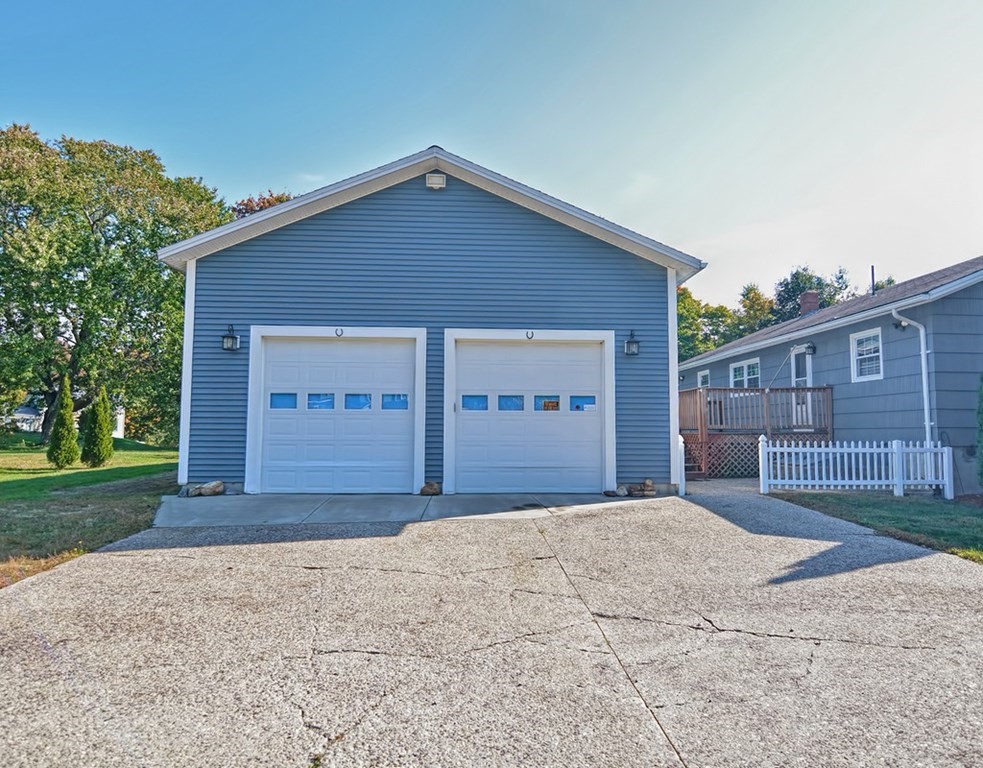 88 Rice Corner Road Brookfield, MA 01506 - Photo 4 of 39 a front view of a house with a yard and garage
