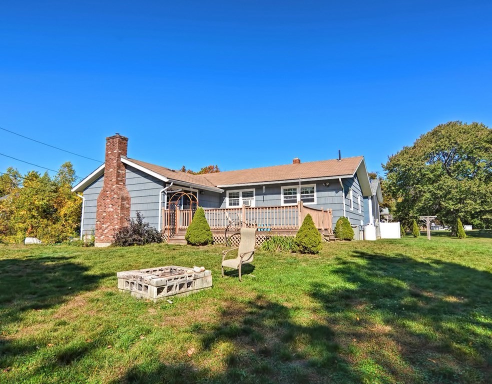 88 Rice Corner Road Brookfield, MA 01506 - Photo 6 of 39 a front view of a house with a yard and garage