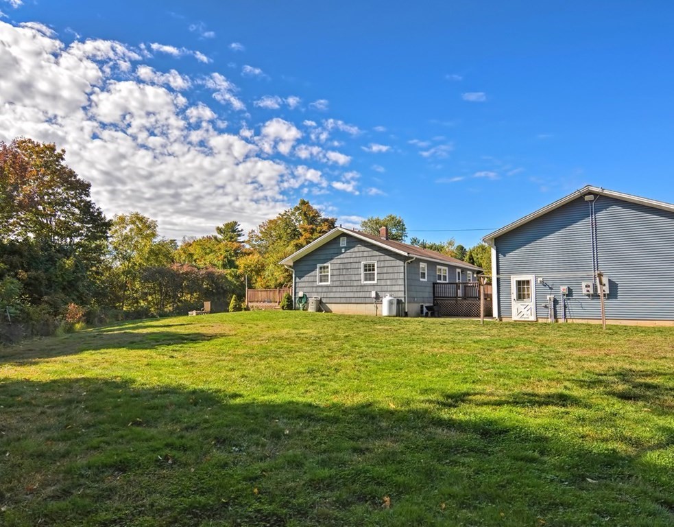 88 Rice Corner Road Brookfield, MA 01506 - Photo 7 of 39 a front view of a house with a big yard