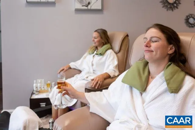 a aerial view of a house with swimming pool patio and outdoor seating