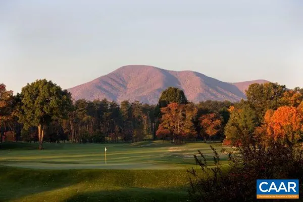 a view of a golf course with a building