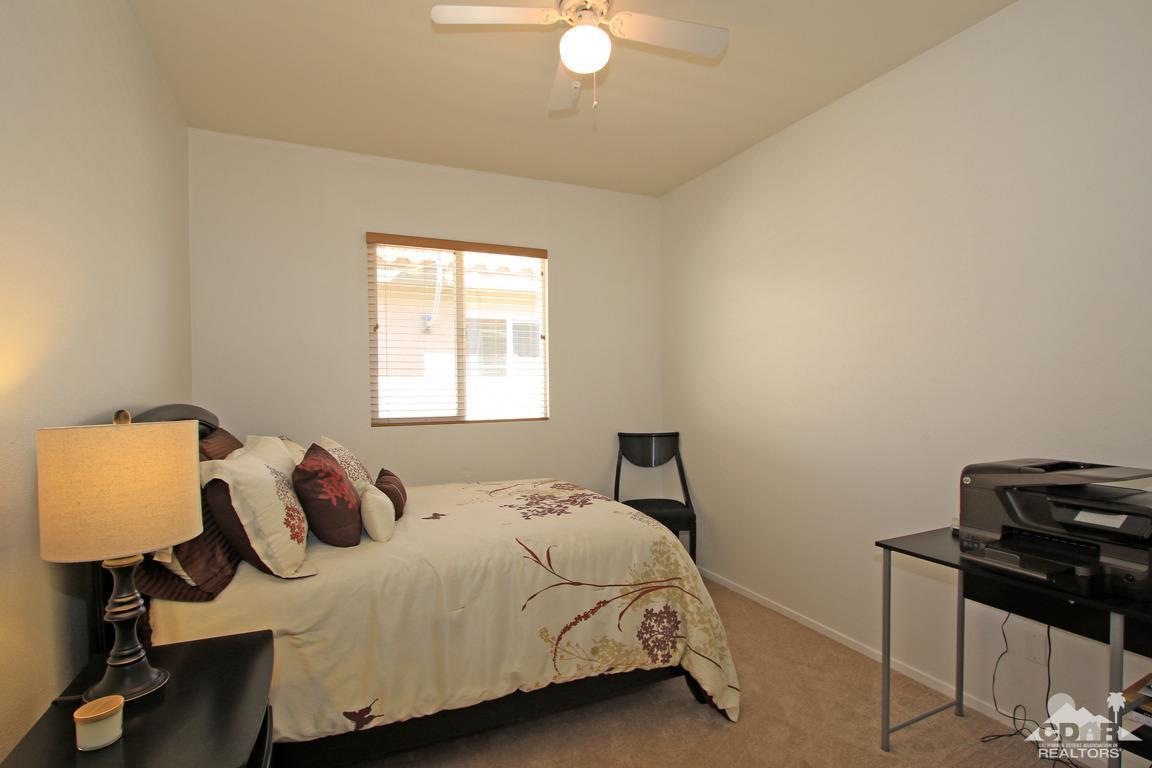 49898 Lewis Road Indio, CA 92201 - Photo 27 of 34 a bedroom with a bed and a window