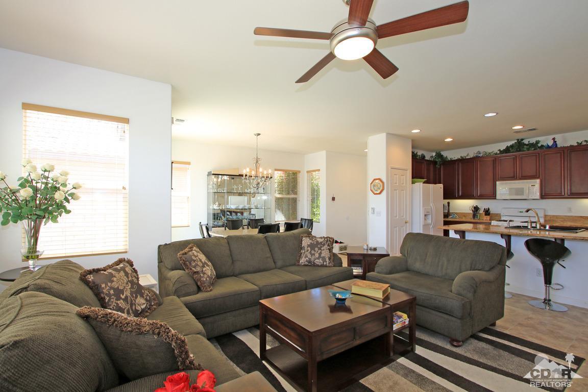 49898 Lewis Road Indio, CA 92201 - Photo 9 of 34 a living room with furniture kitchen view and a potted plant