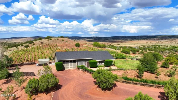 a view of an house with backyard porch and sitting area