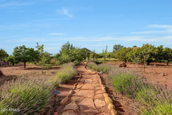 a view of a chairs and table in the balcony