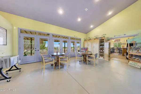 a view of kitchen with stainless steel appliances granite countertop a sink and cabinets