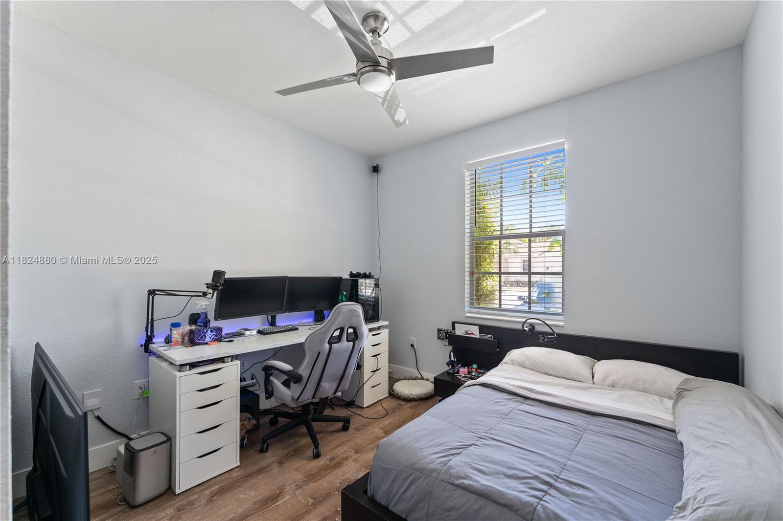 18739 Southwest 28th Street Miramar, FL 33029 - Photo 12 of 15 a bedroom that has a bed and a chair in it