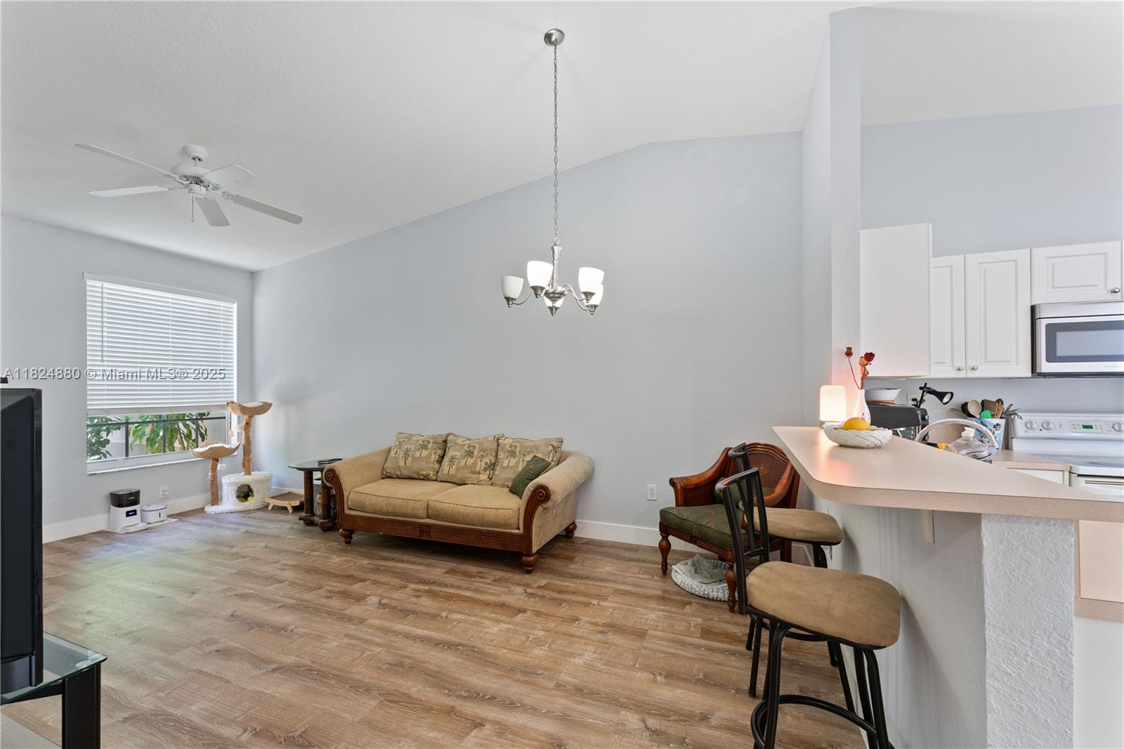 18739 Southwest 28th Street Miramar, FL 33029 - Photo 3 of 15 a living room with furniture and a window
