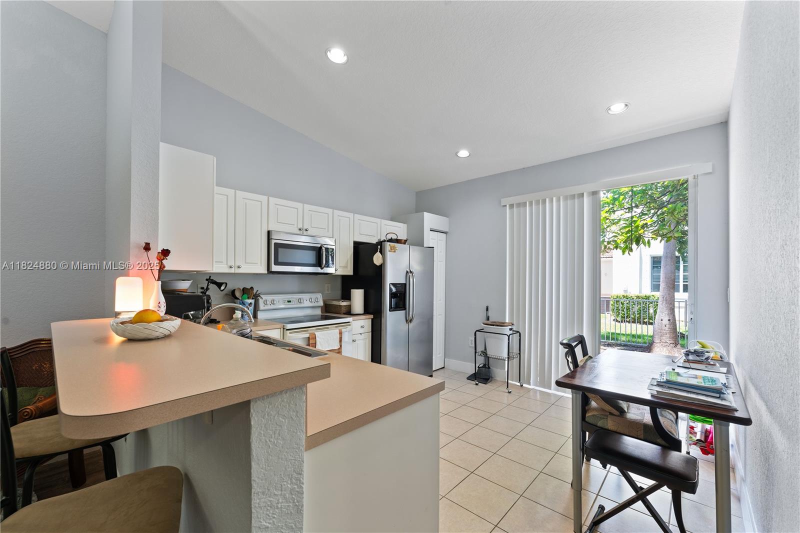 18739 Southwest 28th Street Miramar, FL 33029 - Photo 4 of 15 a kitchen with a table and chairs in it