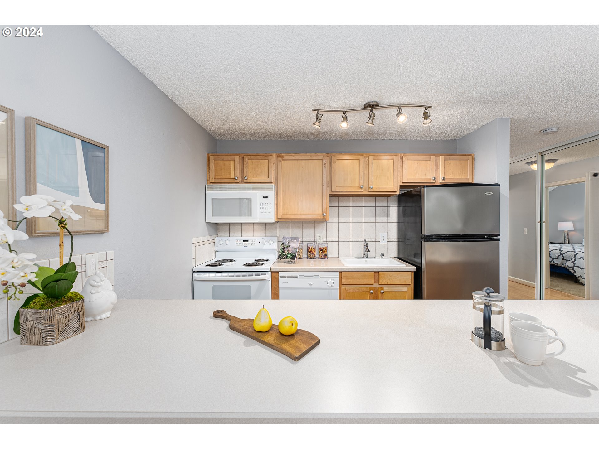 100 Kerr Parkway, Unit 32 Lake Oswego, OR 97035 - Photo 11 of 33 a kitchen with a refrigerator sink cabinets and a window