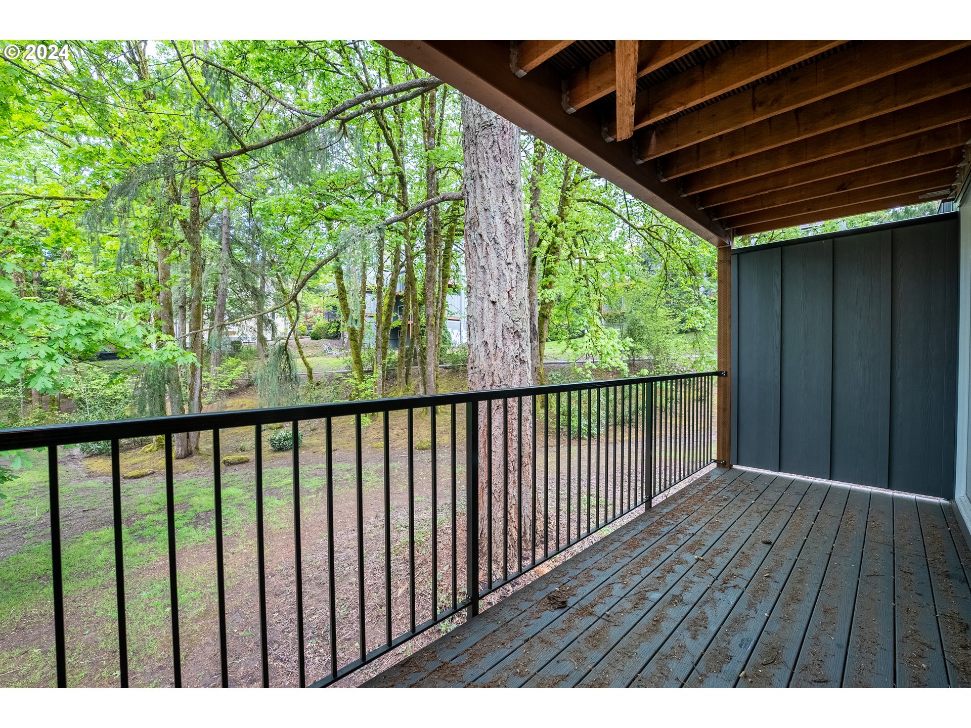 100 Kerr Parkway, Unit 32 Lake Oswego, OR 97035 - Photo 16 of 33 a balcony with wooden floor and outdoor space