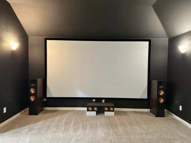 a large white kitchen with stainless steel appliances granite countertop a sink and a large window