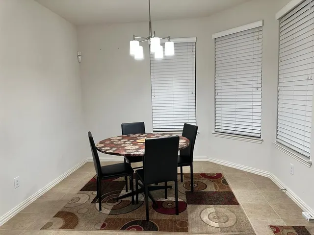 a view of a house with a door and a table