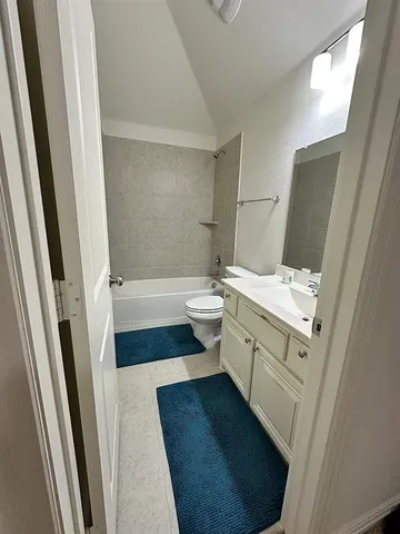 a view of a hallway with stairs