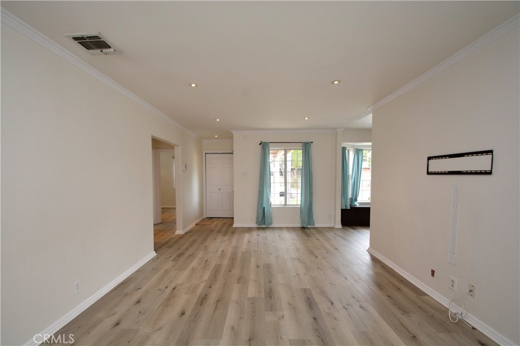 12301 Rives Avenue Downey, CA 90242 - Photo 6 of 20 a view of a livingroom with wooden floor and a window