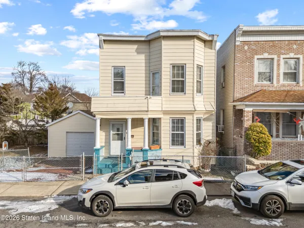a car parked in front of a house