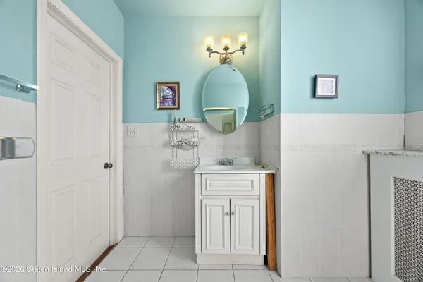 a view of a bathroom with a sink and mirror