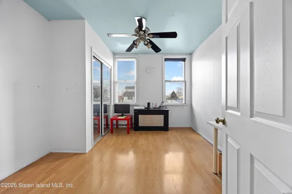 a bedroom with furniture and window