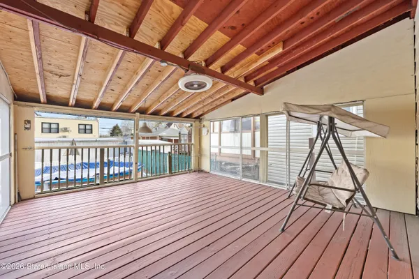 a view of a backyard with sitting area