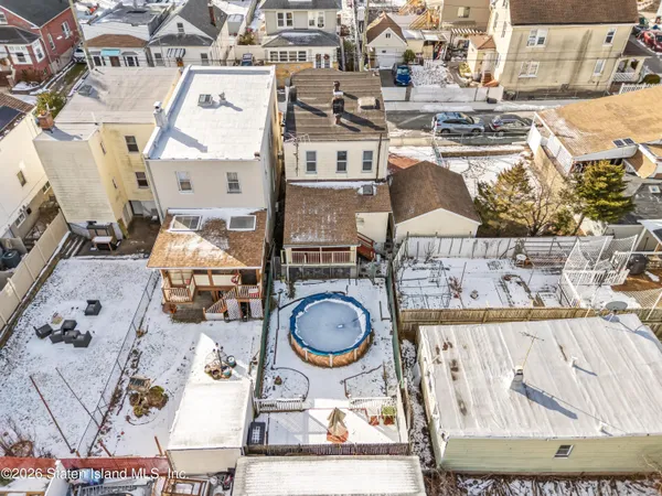 an aerial view of residential house with outdoor space and parking