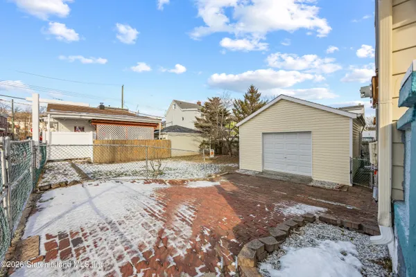 a view of a house with a snow in the yard