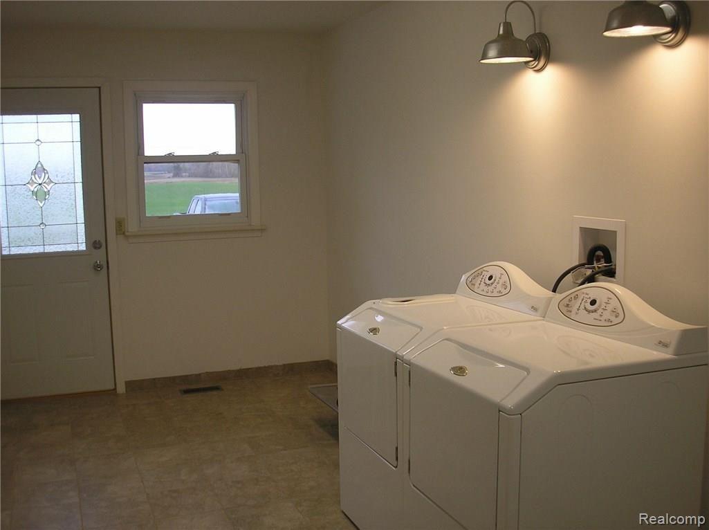 6285 Sanilac Road Kingston, MI 48741 - Photo 8 of 9 12 x 20 combination mud room and utility room with ceramic flooring.