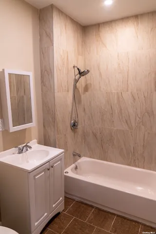 a bathroom with a sink and a bathtub