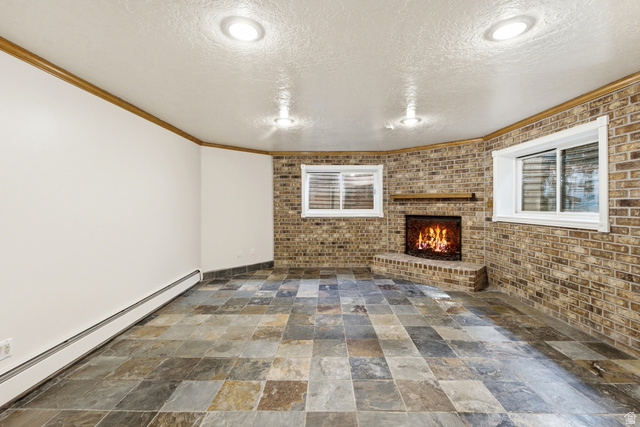 3535 Homestead Road Park City, UT 84098 - Photo 45 of 81 Tile flooring and a corner brick fireplace with a wood mantel