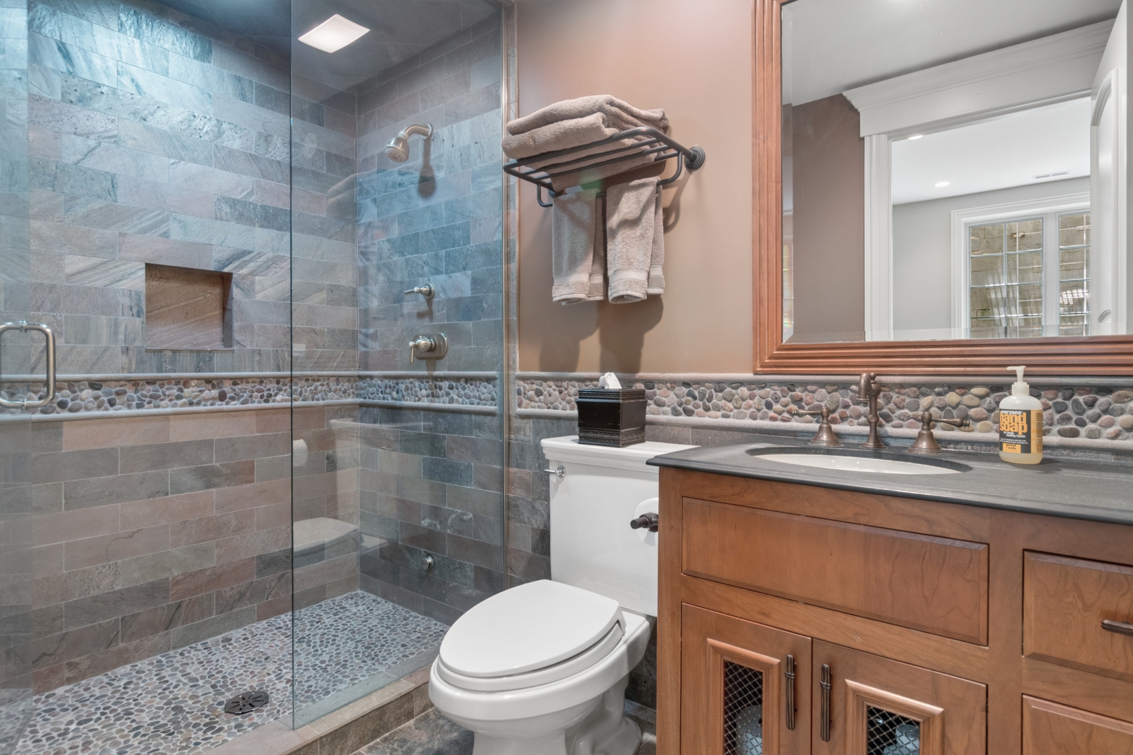 1128 Mt Pleasant Road Winnetka, IL 60093 - Photo 50 of 58 a bathroom with a granite countertop toilet sink and mirror