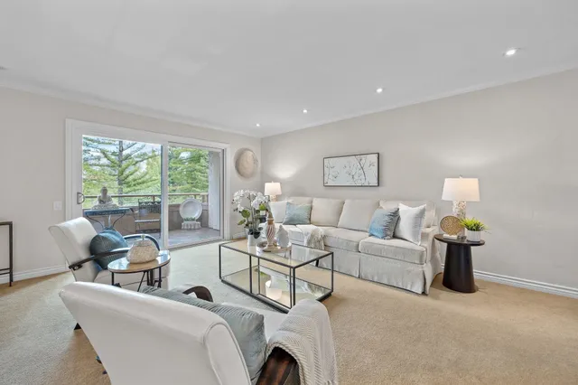 a kitchen with stainless steel appliances granite countertop a sink and cabinets with wooden floor