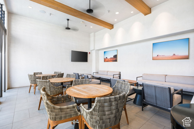 961 West Akoya Pearl Road, Unit 201 St. George, UT 84790 - Photo 46 of 67 Dining room with beam ceiling, a towering ceiling, light tile patterned floors, ceiling fan, and recessed lighting