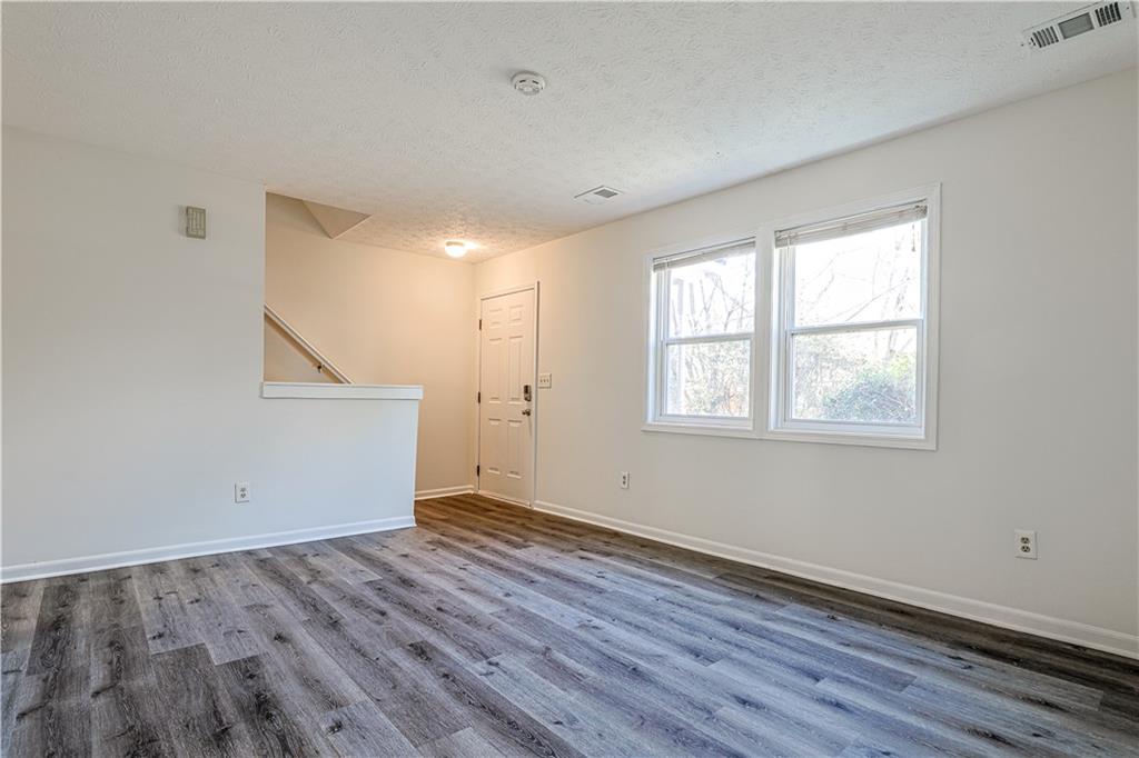 732 South Candler Street Decatur, GA 30030 - Photo 11 of 29 an empty room with wooden floor and windows