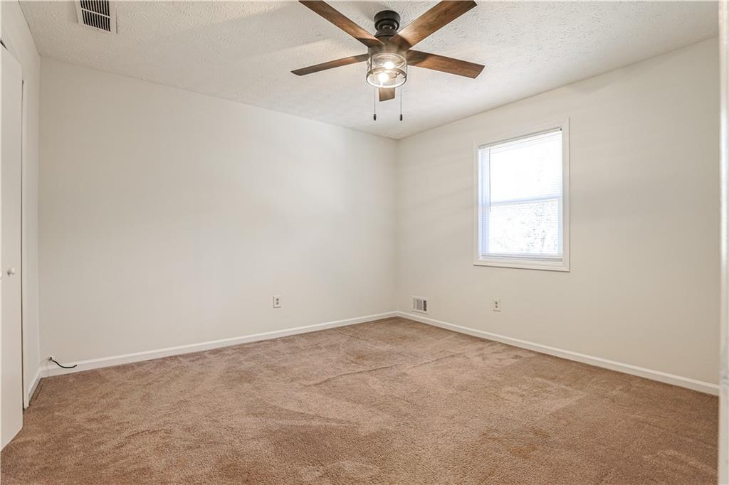 732 South Candler Street Decatur, GA 30030 - Photo 15 of 29 an empty room with a window and a fan
