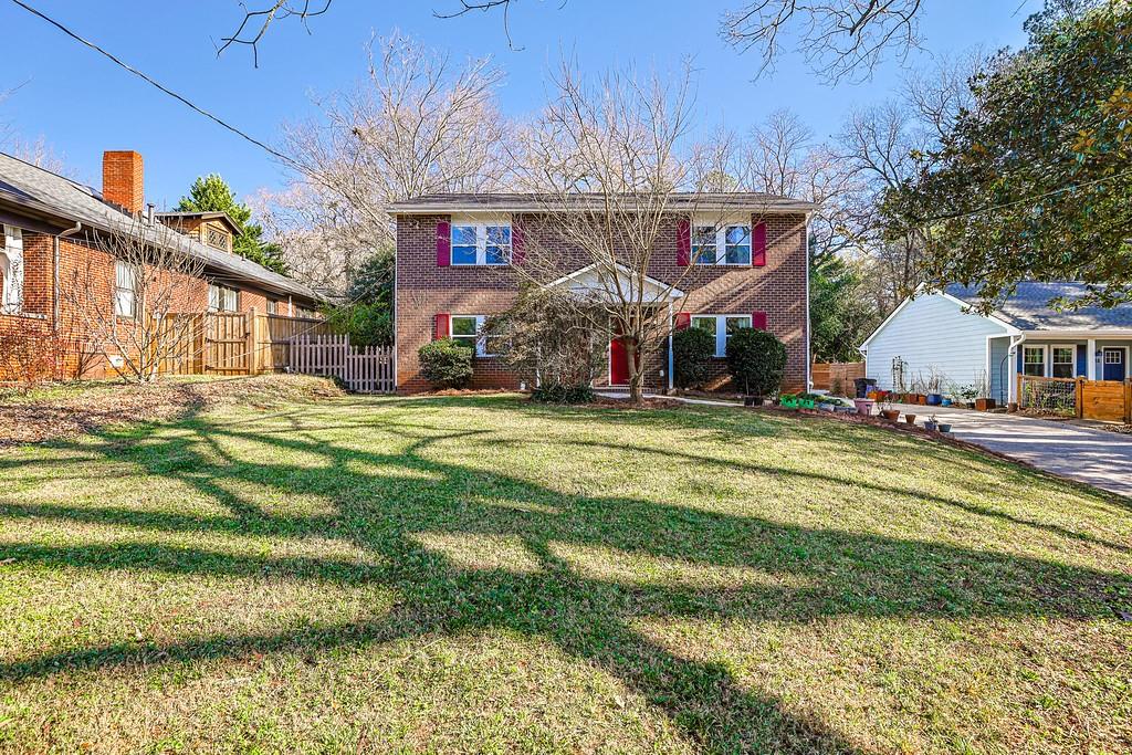 732 South Candler Street Decatur, GA 30030 - Photo 20 of 29 a view of a house with a big yard and large trees